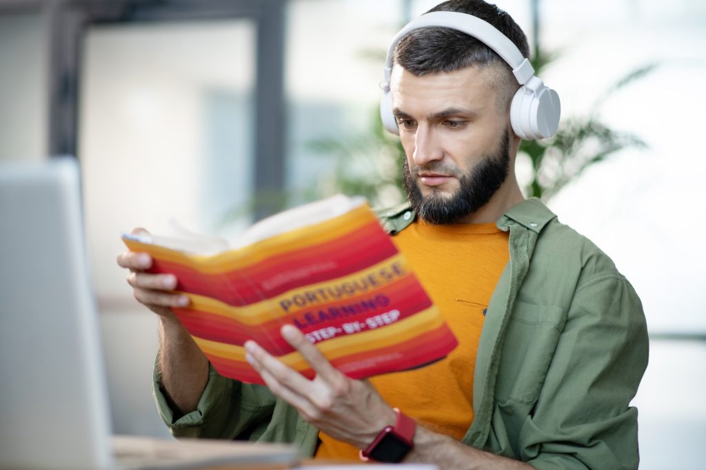 Close up of man having audio lesson in Portuguese language