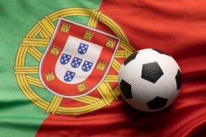 Composition of football over national flag of portugal