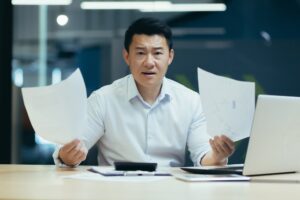 Portrait of dissatisfied business investor